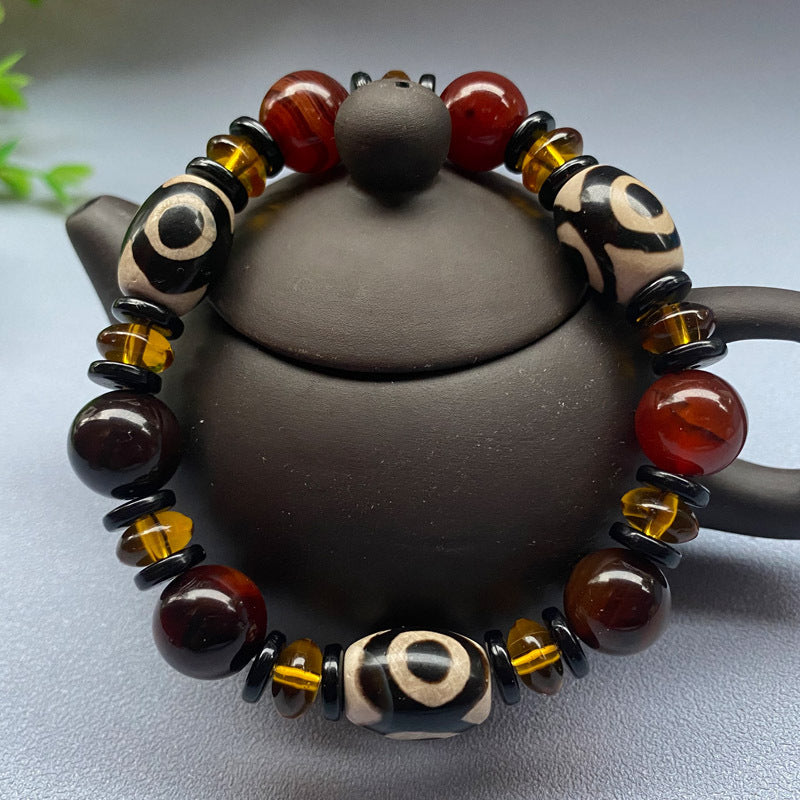 Tibetaanse Dzi-kralenarmband, Drie-oog