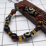 Tibetaanse Dzi-kralenarmband, Drie-oog