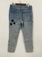 Jeans strappati da uomo con toppa a stella ricamata