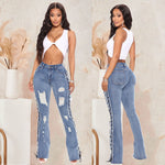 Gescheurde jeans met vetersluiting aan de zijkant