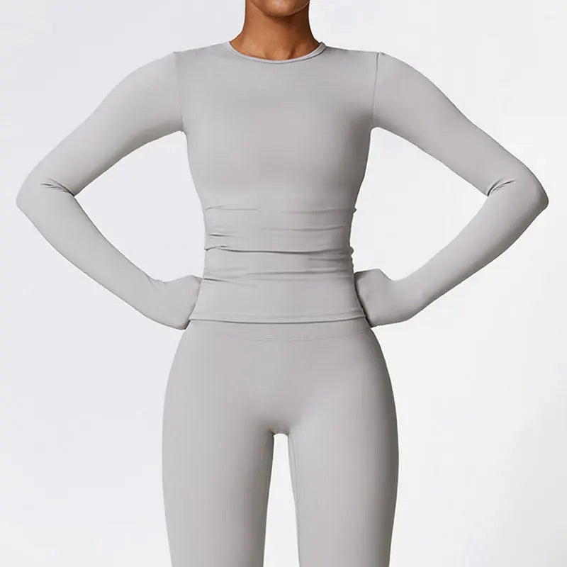 Haut de sport NCLAGEN pour femme, manches longues, idéal pour le fitness, la course et la salle de sport, vêtement d'entraînement respirant, à séchage rapide et hautement élastique.