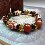 Tibetaanse Dzi-kralenarmband, Drie-oog